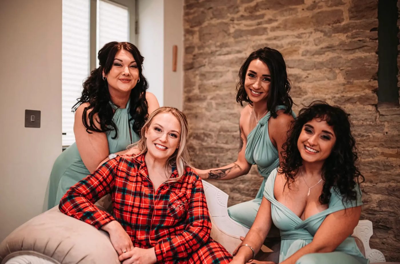 Bride and bridesmaids getting ready together