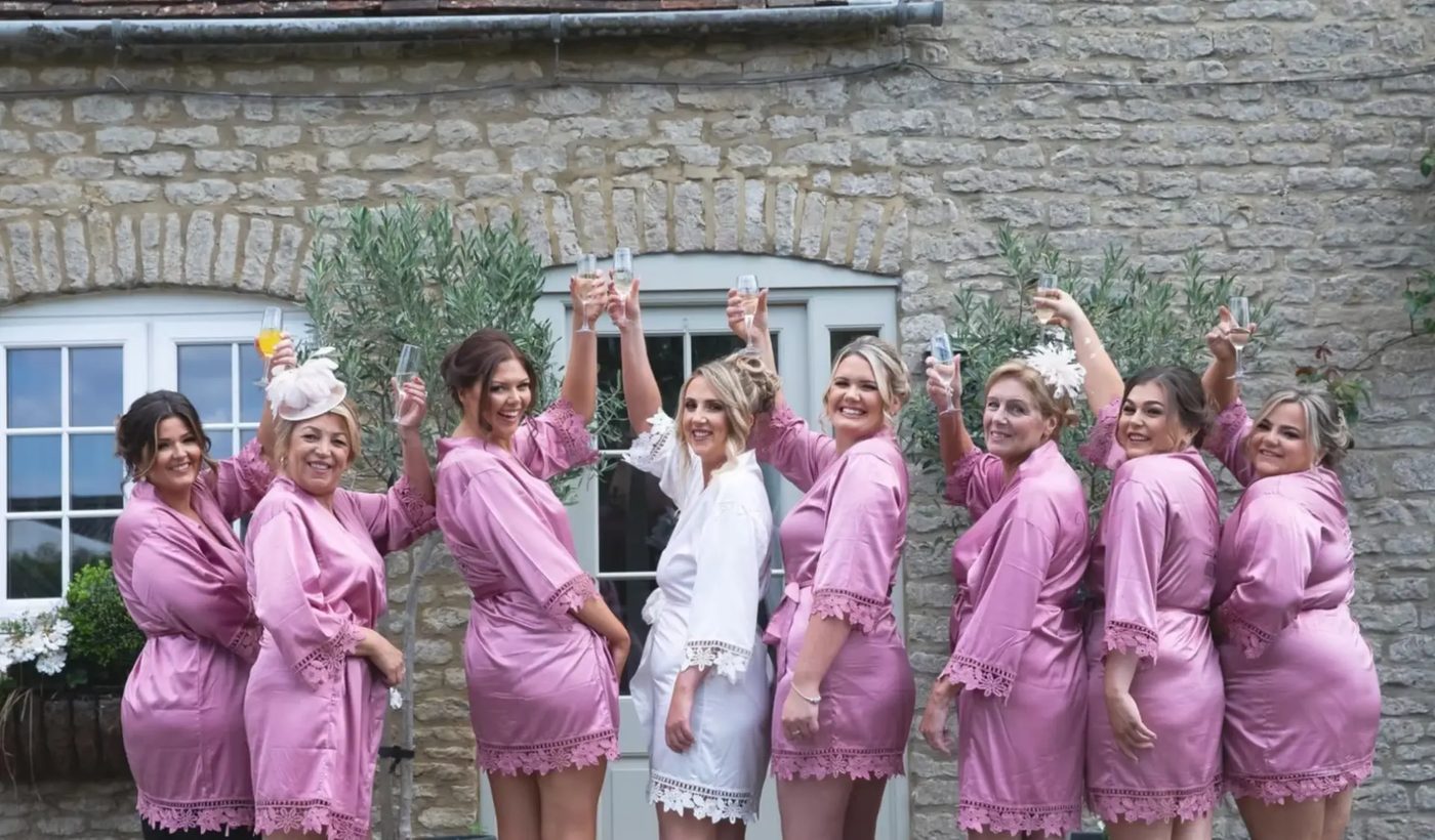 Bride and bridesmaids raising a toast on the wedding morning